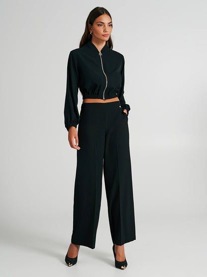 Trousers in technical fabric with slit