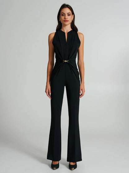 Flared jumpsuit with a jewel at the waist